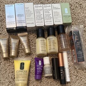 Philosopy, Lancome, and Clinique travel size sample products.